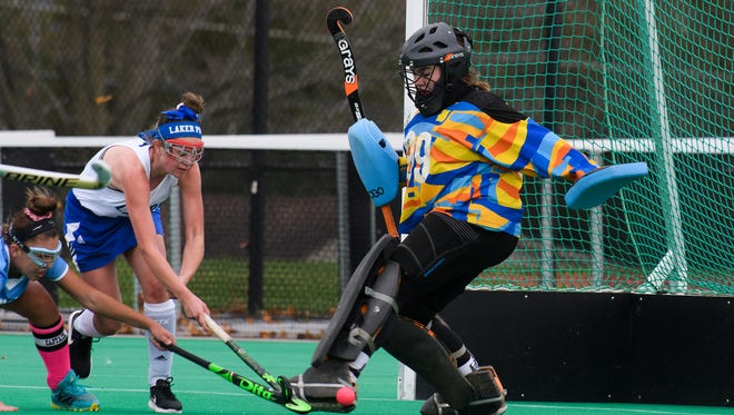 Colchester goalie Ceria Morse (99) makes a save during the girls semi final field hockey game between the Colchester Lakers and the South Burlington Wolves at Moulton Winder field at UVM on Tuesday afternoon October 31, 2017 in Burlington.