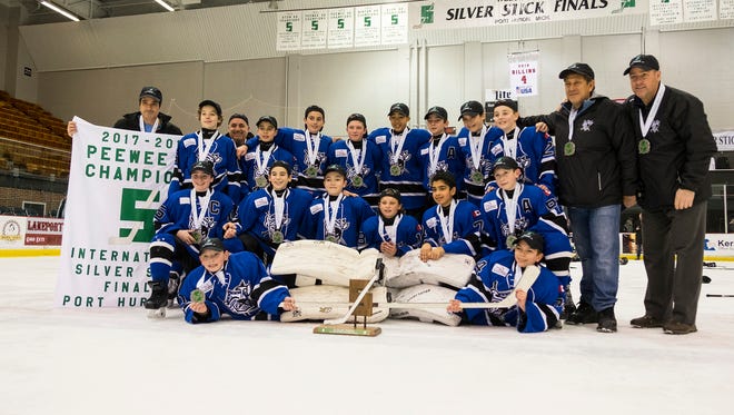 North York Knights celebrate defeating the Orchard Lake United 4-2 in Sunday's Silver Stick Finals PAA finals match at McMorran Arena Jan. 21.