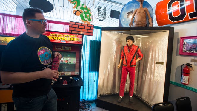 Owner Alex Morgan shows a life-size replica of Michael Jackson on display on Tuesday, Jan. 23, 2018, at Totally 80's Pizza & Museum in Fort Collins, Colo.