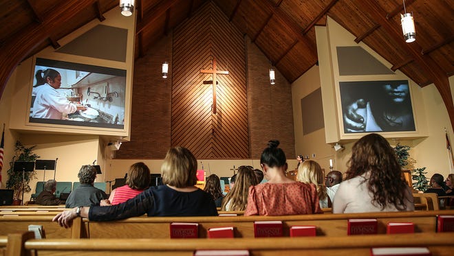 People listen to a presentation by IMPD and the Attorney General's office to raise awareness of human trafficking as the Indianapolis 500 approaches, at Speedway United Methodist Church in Indianapolis, Wednesday, May 23, 2018.