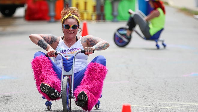 Lindsey Brink races in Indy Pride's Hoosier 250, a tricycle race at Park Avenue and Massachusetts Avenue in Indianapolis, Sunday, May 20, 2017.