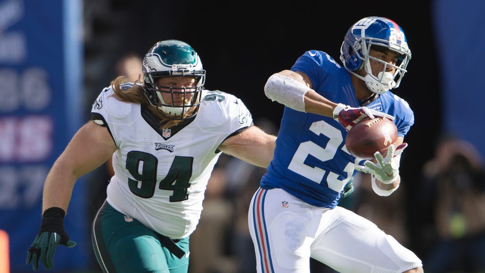 New York Giants running back Rashad Jennings (23) catches the ball defended by Philadelphia Eagles defensive tackle Beau Allen (94) during the first half at MetLife Stadium. Credit: William Hauser-USA TODAY Sports