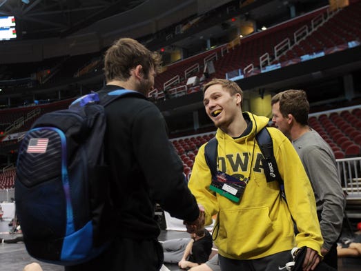 Iowa's Spencer Lee chats with Missouri's Jaydin Eierman