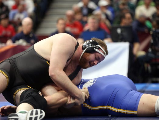 Iowa's Sam Stoll turns Hofstra's Mike Hughes as they