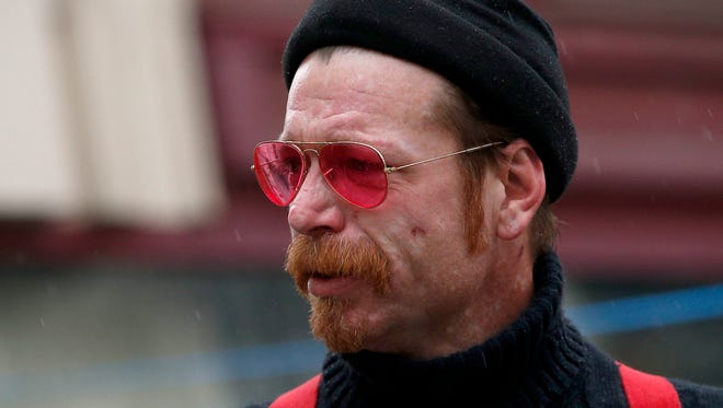 Jesse Hughes, the frontman of the U.S. band Eagles of Death Metal, pays his respects to the victims of the 13th November Attacks in front of the Bataclan in Paris, France, on Dec, 8, 2015.