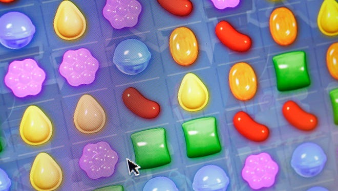 A detail from the online game "Candy Crush Saga" is shown on a computer screen, Monday, March 24, 2014 in New York. King Digital, the company behind the popular, addictive mobile is expected to begin trading on the New York Stock Exchange on March 26. The Dublin, Ireland-based company could be valued as high as $7.6 billion if its initial public offering prices at $24 per share, the upper end of its expected range. (AP Photo/Mark Lennihan) ORG XMIT: NYML104