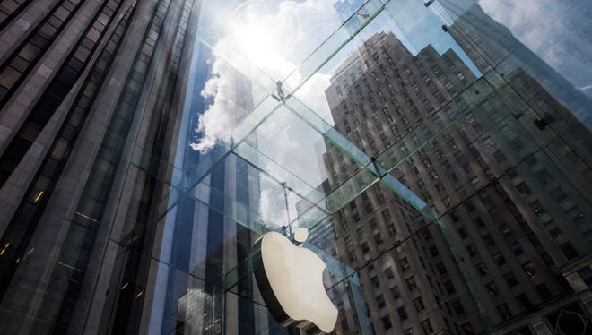 The Apple logo hangs on the Apple Store on Fifth Avenue on August 5, 2015 in New York City.