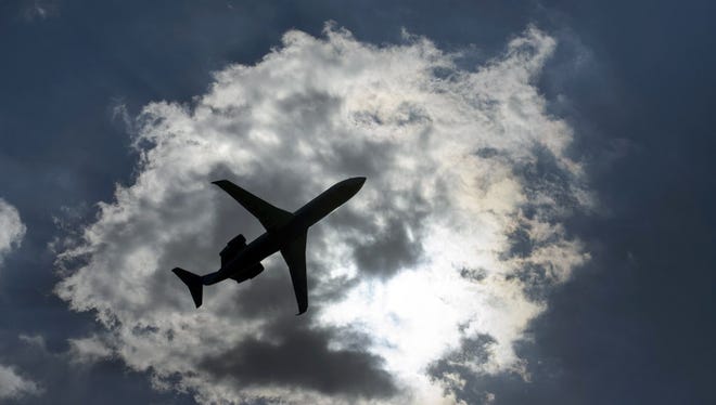 A passenger jet takes off July 24, 2015, from National Airport in Arlington, Va.