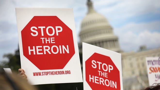 Activists and family members of loved ones who died in the opioid/heroin epidemic take part in a "Fed Up!" rally at Capitol Hill on September 18, 2016, in Washington, DC. Protesters called on legislators to provide funding for the Comprehensive Addiction and Recovery Act, which Congress passed in July without funding. Some 30,000 Americans die each year due to heroin and painkiller pill addiction in the United States.