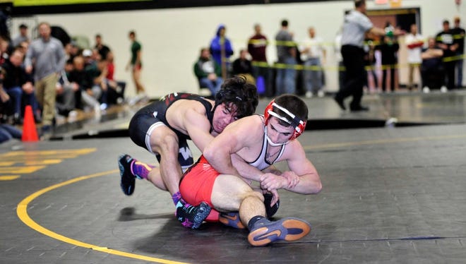 Anthony Rua of Wayne Hills stays in control over Pompton Lakes' Chris Grecco in the Passaic County 138-pound finals.