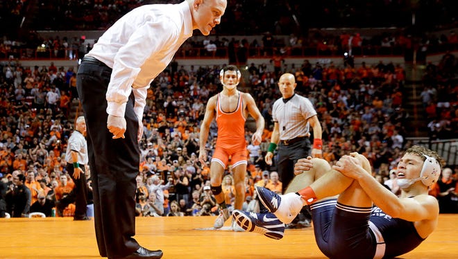 Former Bergen Catholic wrestler Nick Suriano withdrew from the NCAA Tournament with an injury he suffered earlier this season.