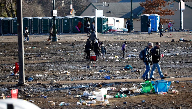Fans leave a sea of mud and trash after the Super Bowl parade and celebration in front of the Philadelphia Museum of Art.