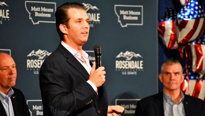Donald Trump Jr., center, speaks to Montana Republicans at the state party's annual convention as U.S Rep. Greg Gianforte, left, and senate candidate Matt Rosendale, right, look on, at the Billings Hotel and Convention Center Friday, June 22, 2018, in Billings, Mont. Trump Jr. warned Republicans that Democrats are highly motivated heading into the November election. (AP Photo/Matthew Brown)