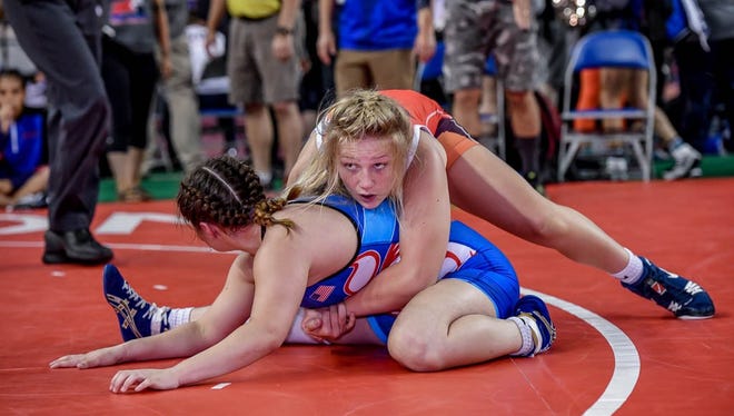 Stewartstown's Tiffani Baublitz, top, seen here in a file photo, won a state girls' wrestling title at 147 pounds on Sunday. SUBMITTED