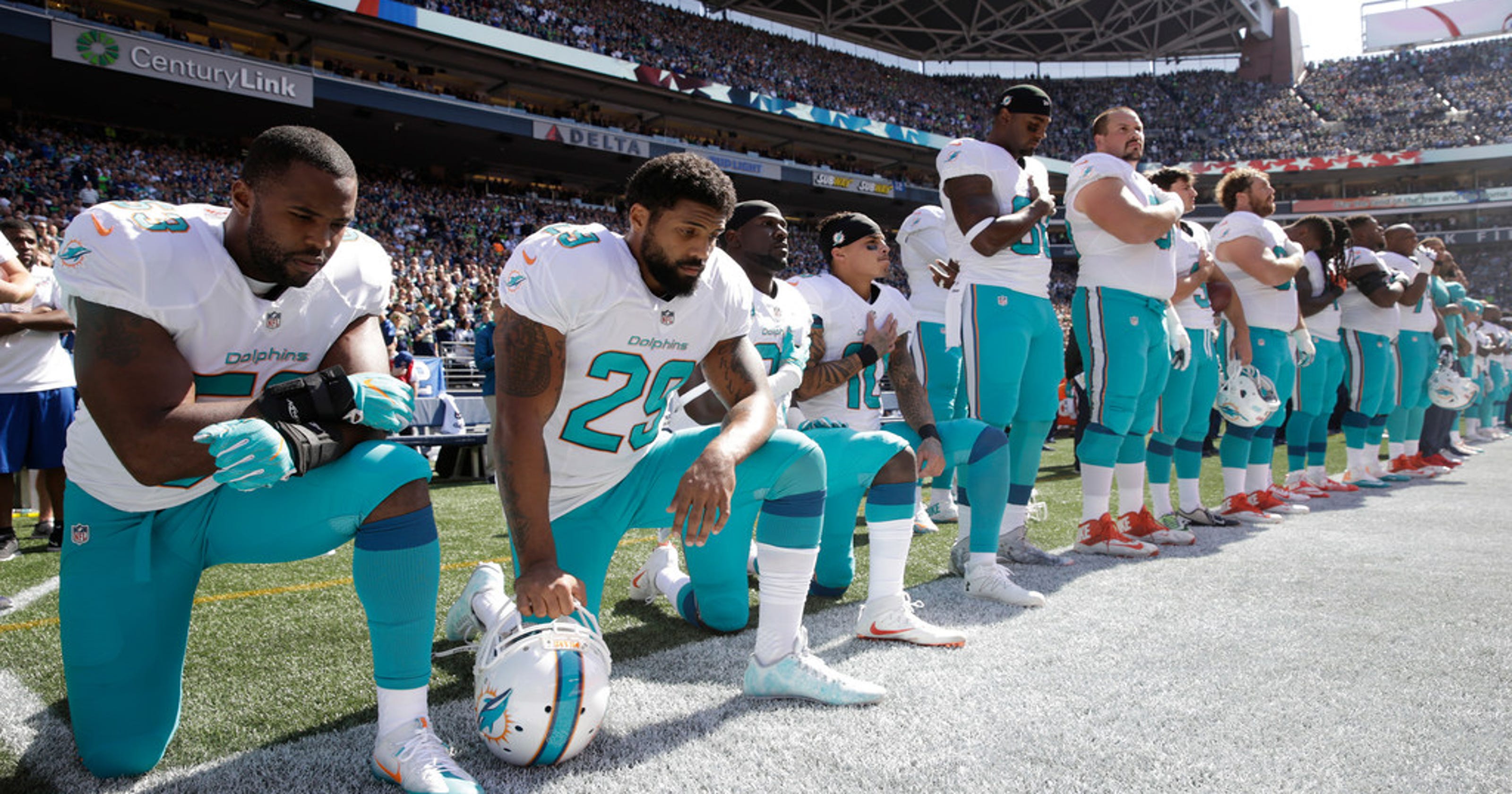 NFL players kneeling