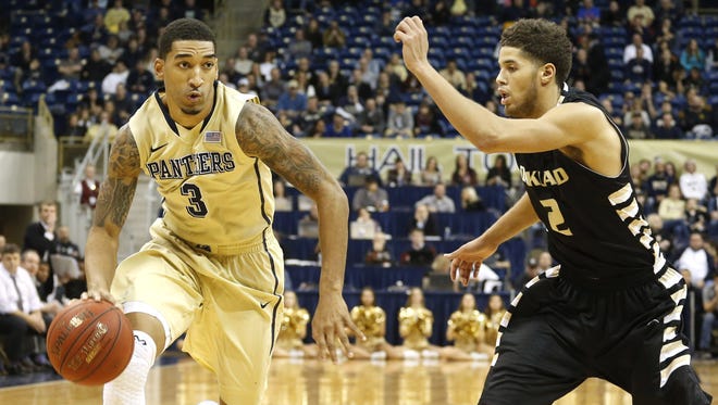Pittsburgh Panthers guard Cameron Wright (3) dribbles the ball past Oakland Golden Grizzlies forward Dante Williams (2) during the overtime period at the Petersen Events Center. PITT won 81-77 in overtime.