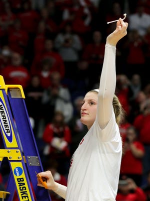 Louisville's Sam Fuehring cuts down the net after the Cards defeat Oregon State and earn a trip to the Final Four. March 25, 2018
