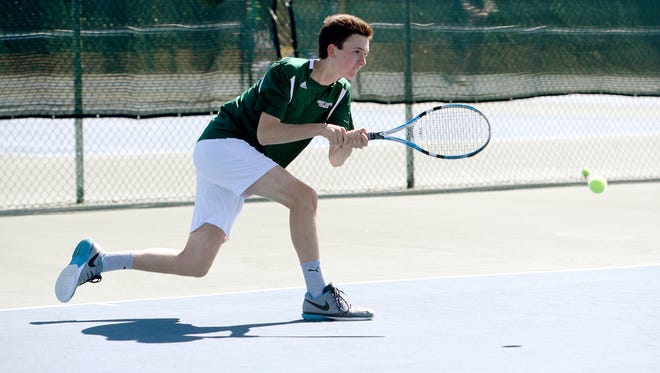 Christ School's Kiffen Loomis returns a shot during Tuesday's home match against Asheville School.