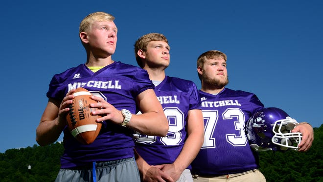 Mitchell High School returning junior quarterback Ben Young, left, senior tight end Alex McKinney, and left tackle Todd Self are returning all-conference players for the Mountaineers. 