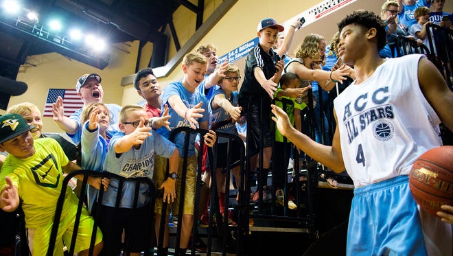 Young fans greet UNC basketball star Isaiah Hicks as he enters Kimmel Arena on the UNC Asheville campus Saturday afternoon April 22, 2017 for the Crossfire-ACC All Stars basketball game.