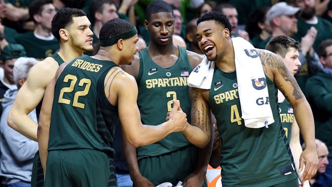 Michigan State players celebrate on the bench during the second half of the 91-61 drubbing of Maryland on Thursday.