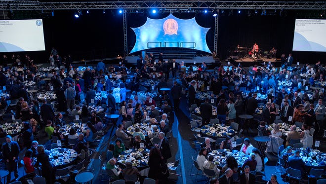 Guests mingle during the fourth-annual Lansing Promise Dinner on Thursday, April 26, 2018, at the Breslin Center on the Michigan State University campus in East Lansing. The event raises money for the Lansing Promise, a scholarship that helps Lansing graduates take up to 65 credits at Lansing Community College for free or receive the equivalent in fees and tuition to attend Michigan State University or Olivet College.