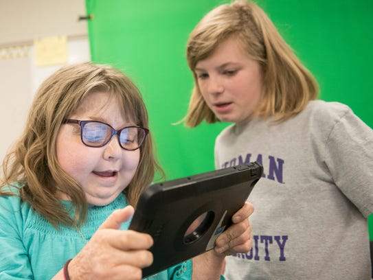Reese Burdette, left, and Nina McDowell are in a video production class on Thursday, March 15, 2018. Reese  returned to her Mercersburg Elementary School class on March 2 after a 100-day quarantine after a kidney transplant. She survived a house in 2014 and has had medical issues along the way.