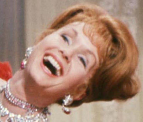 Debbie Reynolds dances with Harve Presnell,  in a scene from the 1964 motion picture 