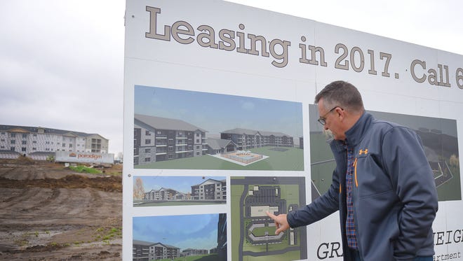 Joel Dykstra, developer for RMB associates, talks about the layout of Graystone Apartments, Thursday, Oct. 5, in Sioux Falls. Half of the apartments are finished and the other half are under construction. As of October 330 apartments are filed.