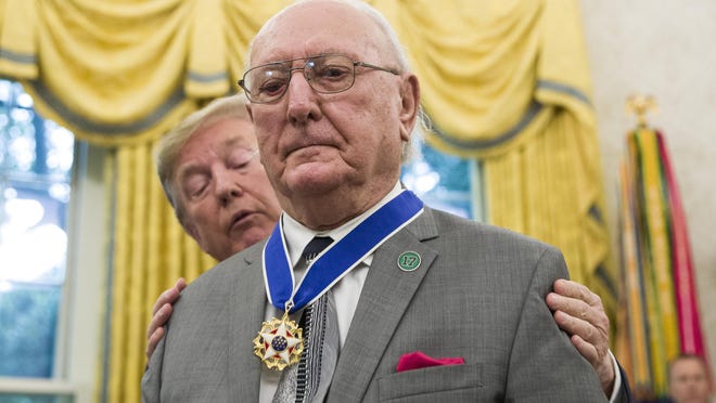 President Donald Trump presents the Presidential Medal of Freedom to former NBA basketball player and coach Bob Cousy, of the Boston Celtics, during a ceremony in the Oval Office of the White House, Thursday, Aug. 22, 2019, in Washington.