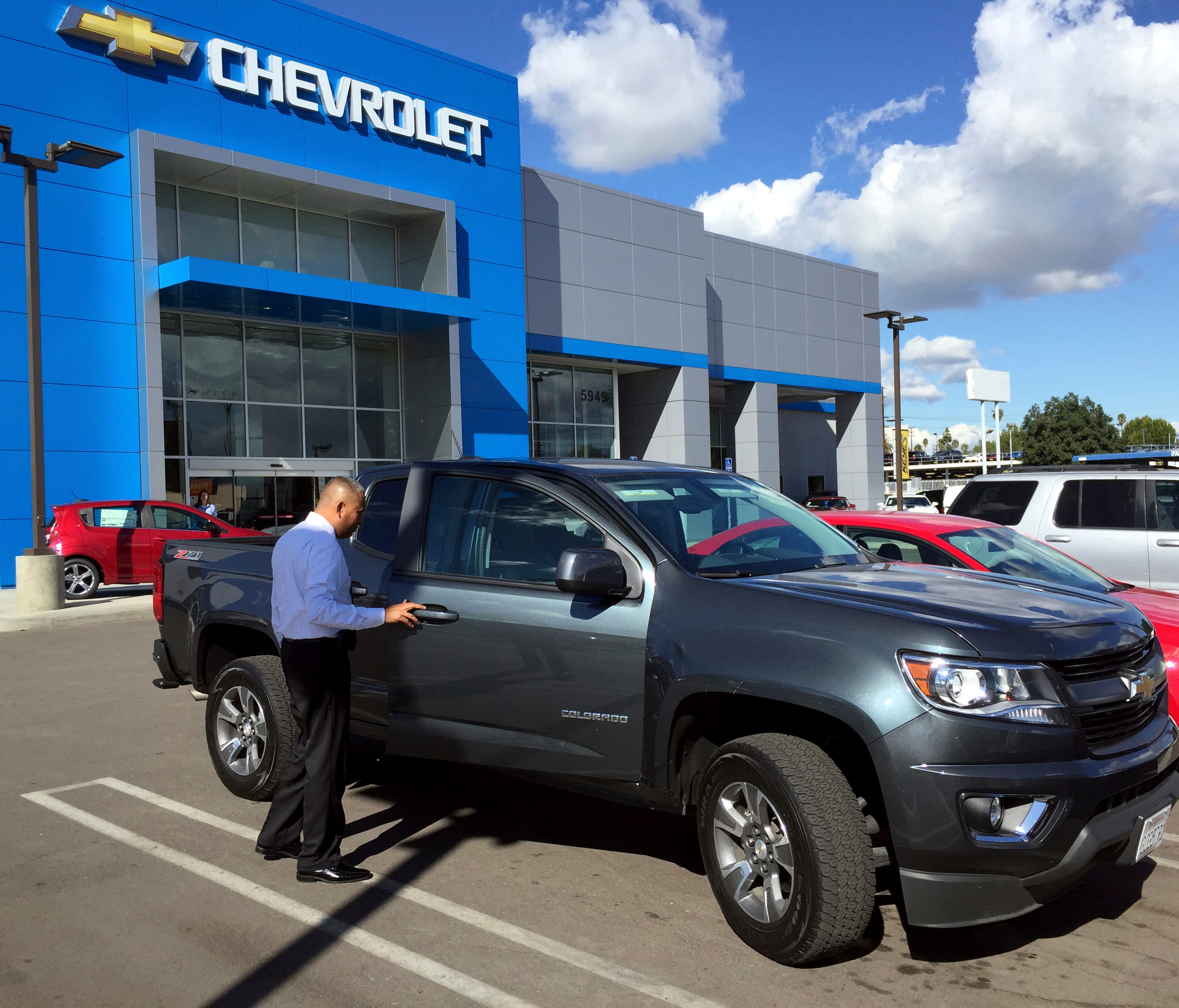 This November 2015 photo provided by Edmunds shows a 2015 Chevrolet Colorado being appraised at a Chevrolet dealership in the Van Nuys neighborhood of Los Angeles. Your first step in getting a clear-eyed estimate of your car's value is to appraise it