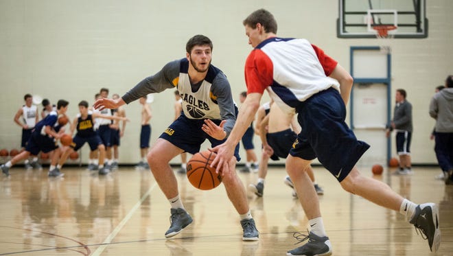 Delta's Boys Basketball Team practices in the side gym of Delta High School Monday afternoon.