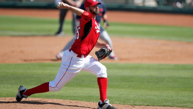Reds pitcher Burke Badenhop delivers to the plate during the Cactus League game against the Cleveland Indians, Thursday, March 5, 2015, in Goodyear, Arizona. The Enquirer/Kareem Elgazzar