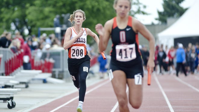 Aspen Hansen carries the baton Saturday, May 27, during the Class A state track meet at Howard Wood Field in Sioux Falls as part of the 4x200-meter relay team that finished eighth with a time of 1:50.02.