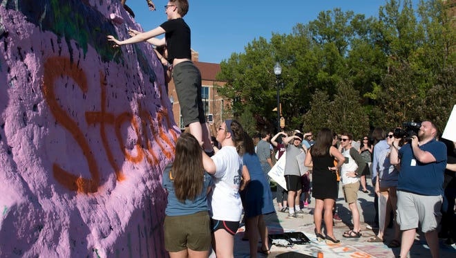 University of Tennessee students gather at The Rock in a rally of support for Beverly Davenport on Wednesday, May 2, 2018. 