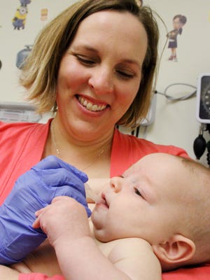 Sarah Baker brought her 4-month-old daughter, Mackenzie, in for her wellness checkup.