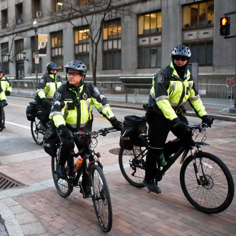 A group of Pittsburgh police on bicycles ride...