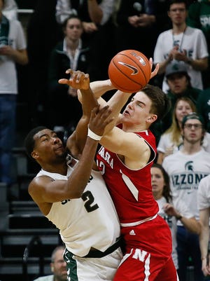 Michigan State's Javon Bess fights for the rebound against Nebraska's Michael Jacobson during the second half of MSU's loss Wednesday at the Breslin Center.
