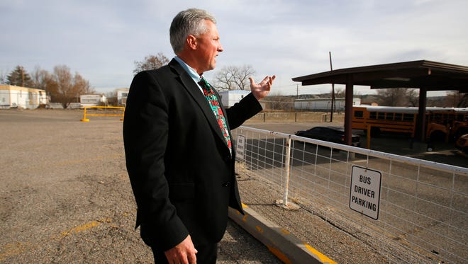 Aztec Municipal School District Superintendent Kirk Carpenter talks last month about the district's planned solar energy project outside the district's administration office in Aztec.