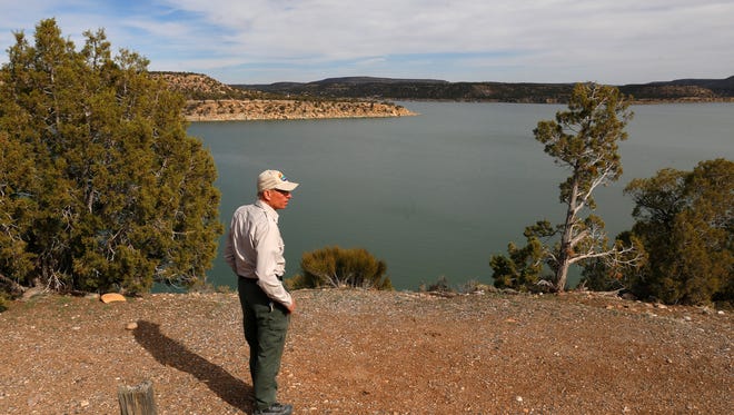 Park Superintendent Gary Skiba looks across Navajo Lake March 4 near the Pinon Loop campground.