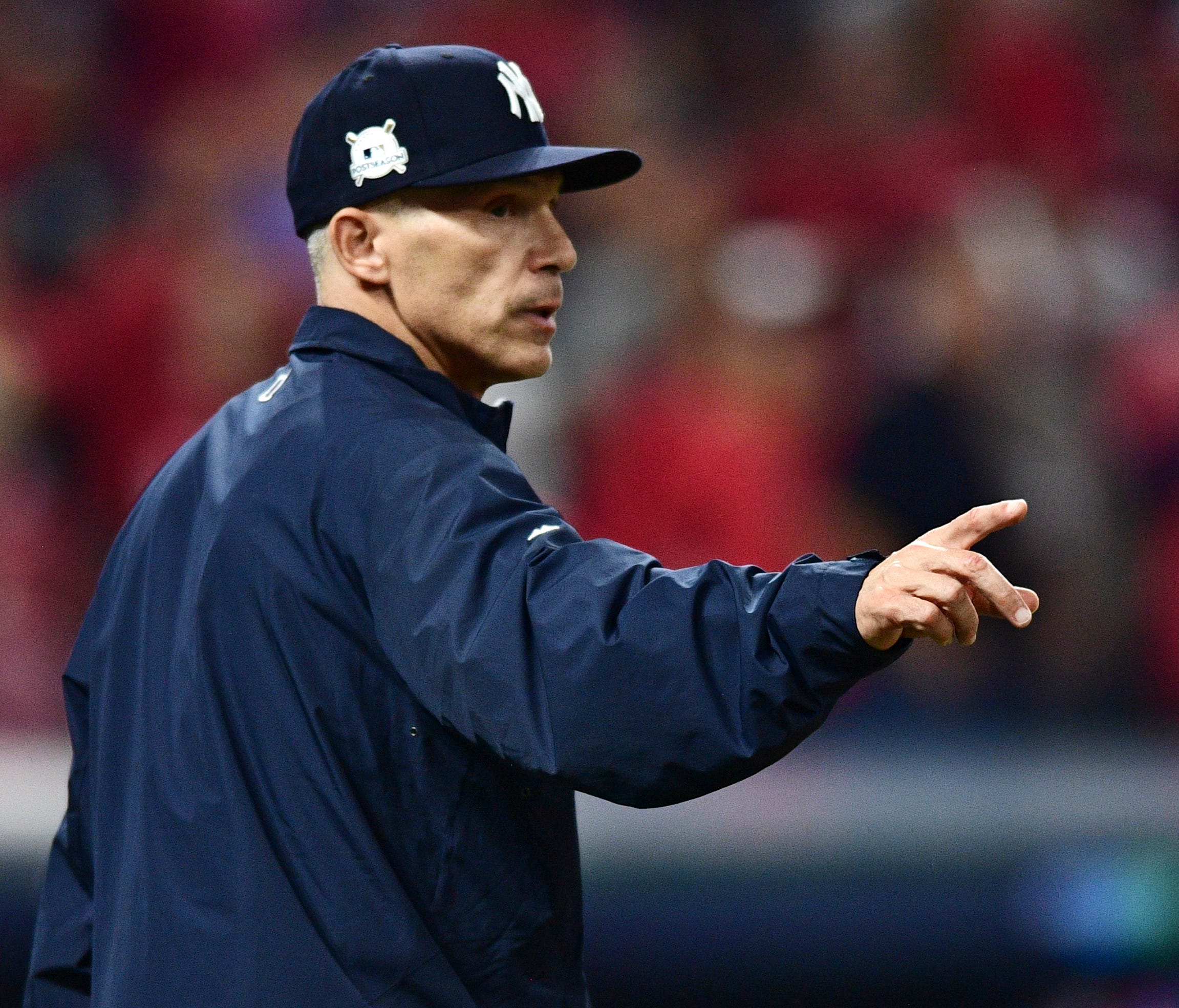 New York Yankees manager Joe Girardi makes a pitching change in the eighth inning of Game 2 of baseball's American League Division Series against the Cleveland Indians, Friday, Oct. 6, 2017, in Cleveland.