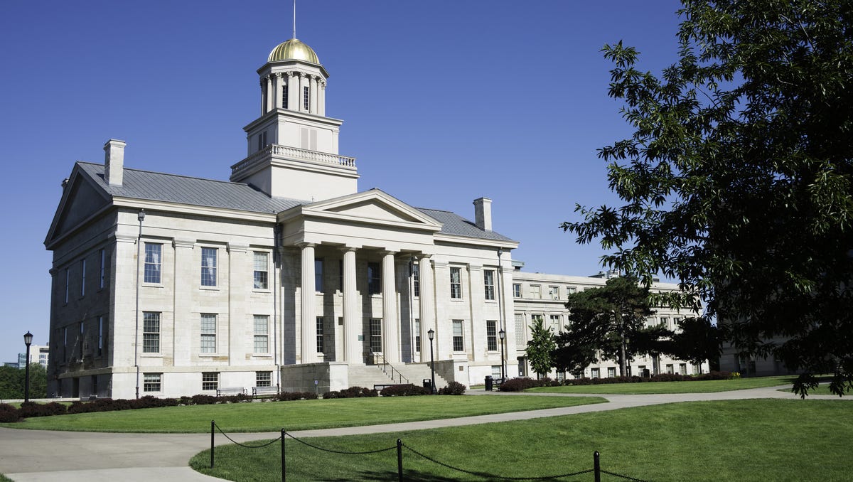 Kim Reynolds signs law changing how Iowa counties with public universities elect supervisors