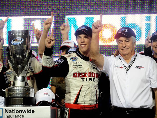 Nov. 20, 2010: NASCAR Nationwide Series driver Brad Keselowski (left) and team owner Roger Penske celebrate the 2010 championship following the Ford 300 at Homestead Miami Speedway.