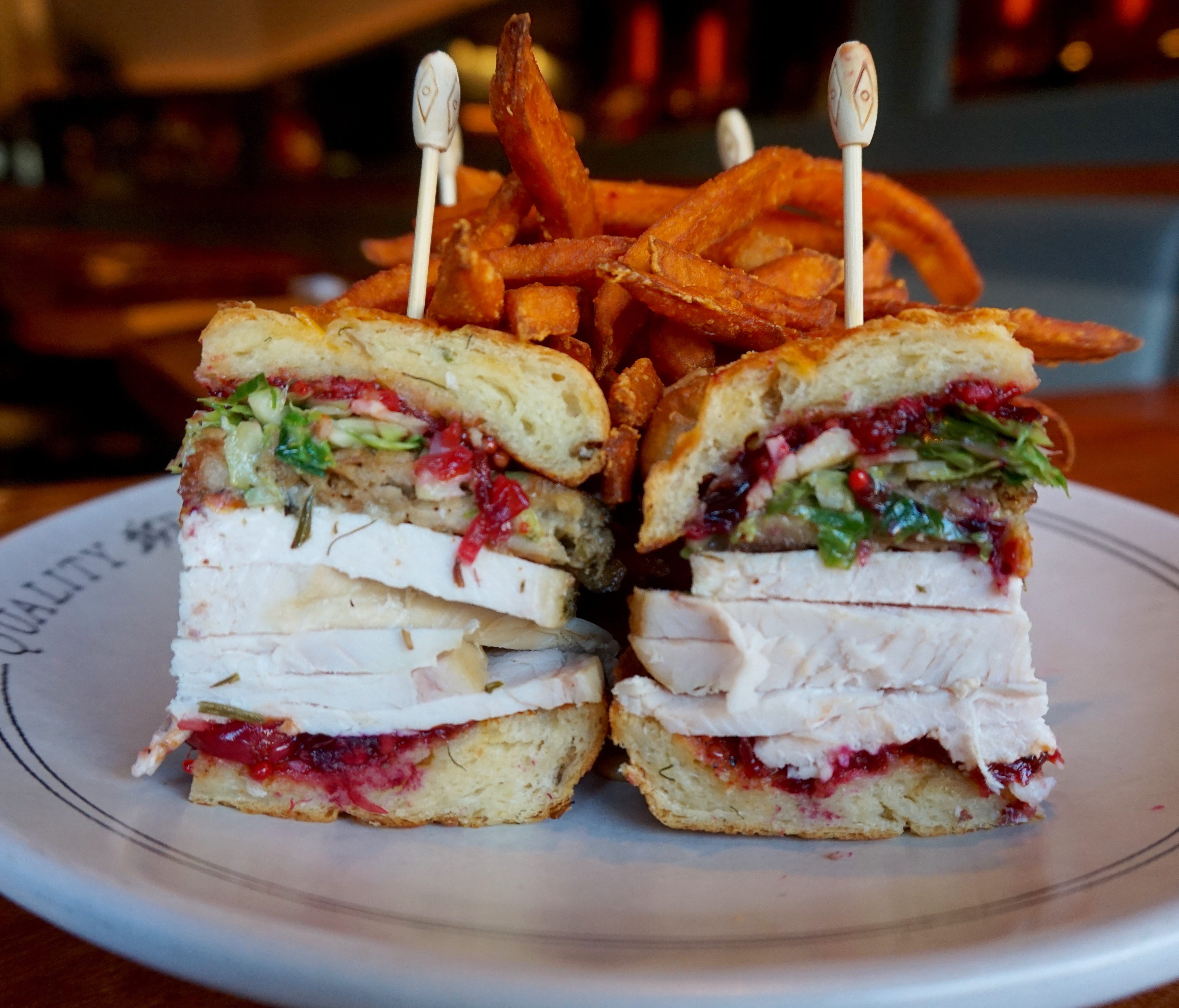 In New York City, Quality Eats offers the Roasted Turkey Monkey Bread Sandwich, with layers of roasted turkey, a Faicco's sausage stuffing and cranberry mostarda, on house monkey bread, November 23 through December 1.