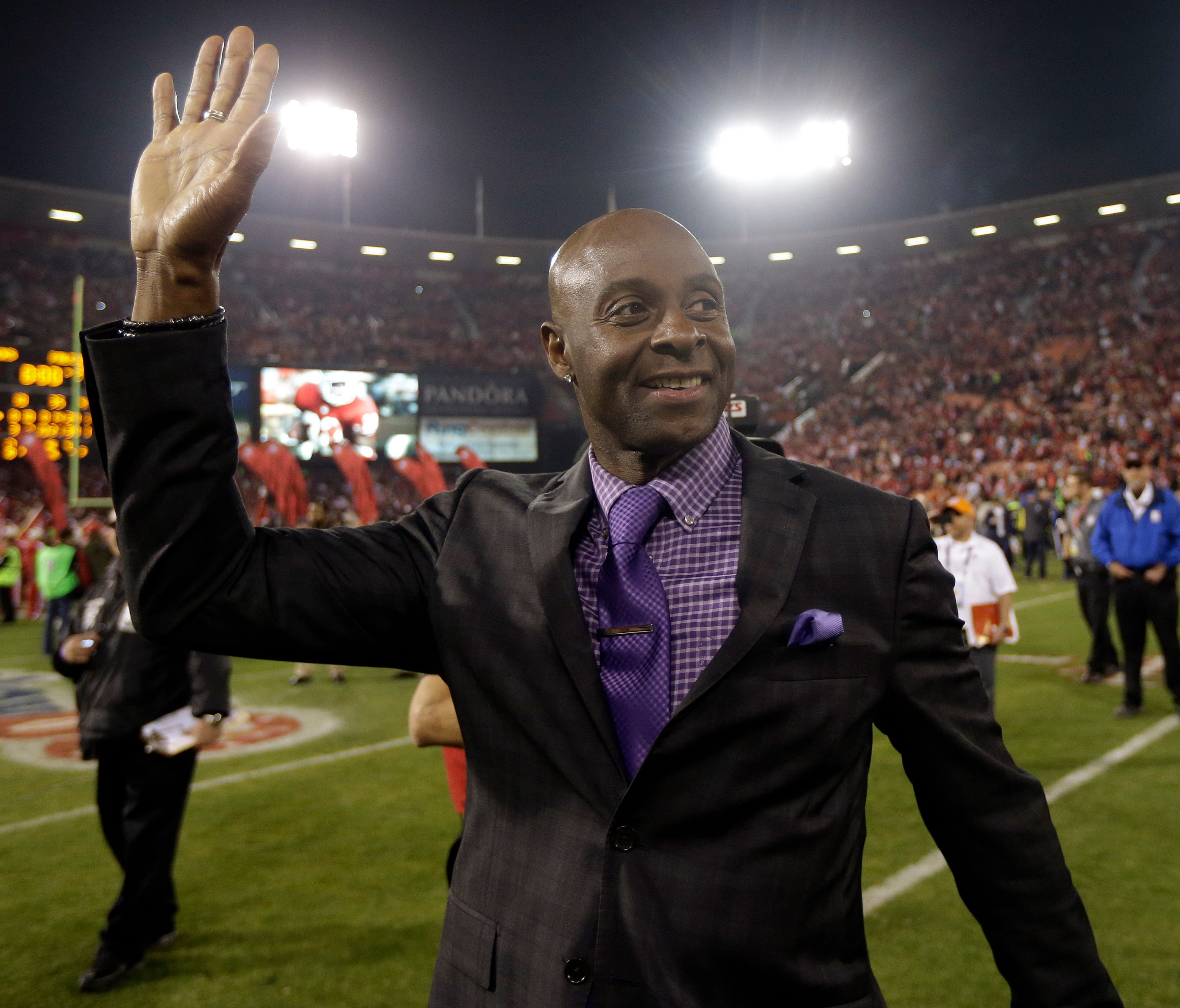 FILE - In this Dec. 23, 2013, file photo, former San Francisco 49ers player Jerry Rice waves to the crowd at Candlestick Park after an NFL football game between the 49ers and the Atlanta Falcons in San Francisco. Rice put on the cleats and took part 