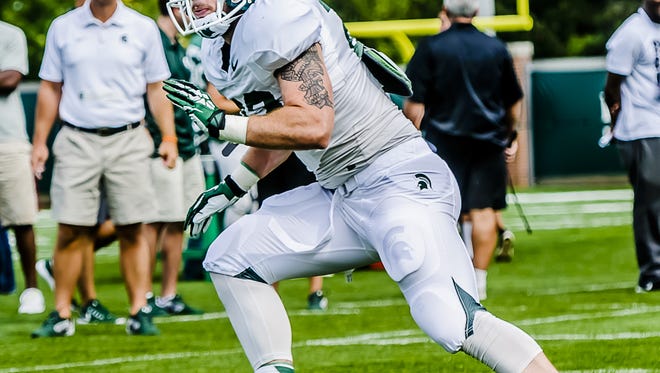 MSU linebacker Chris Frey moves to take on a runner in a drill during a summer camp practice Wednesday August 6, 2014 at the Duffy Daugherty Building in East Lansing.