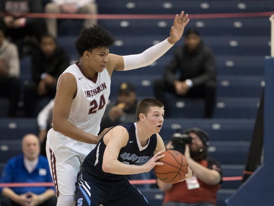 Shawnee’s Dean Noll looks to pass the ball as he’s