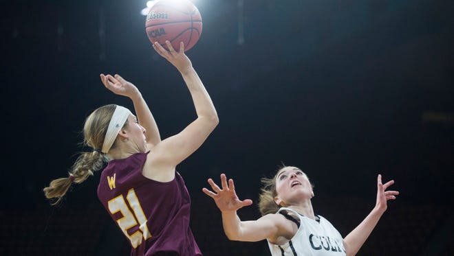 Michaela Moran of Windsor shoots over Hannah Kochen of Pueblo South High School during the Wizards 53-41 Final Four loss.