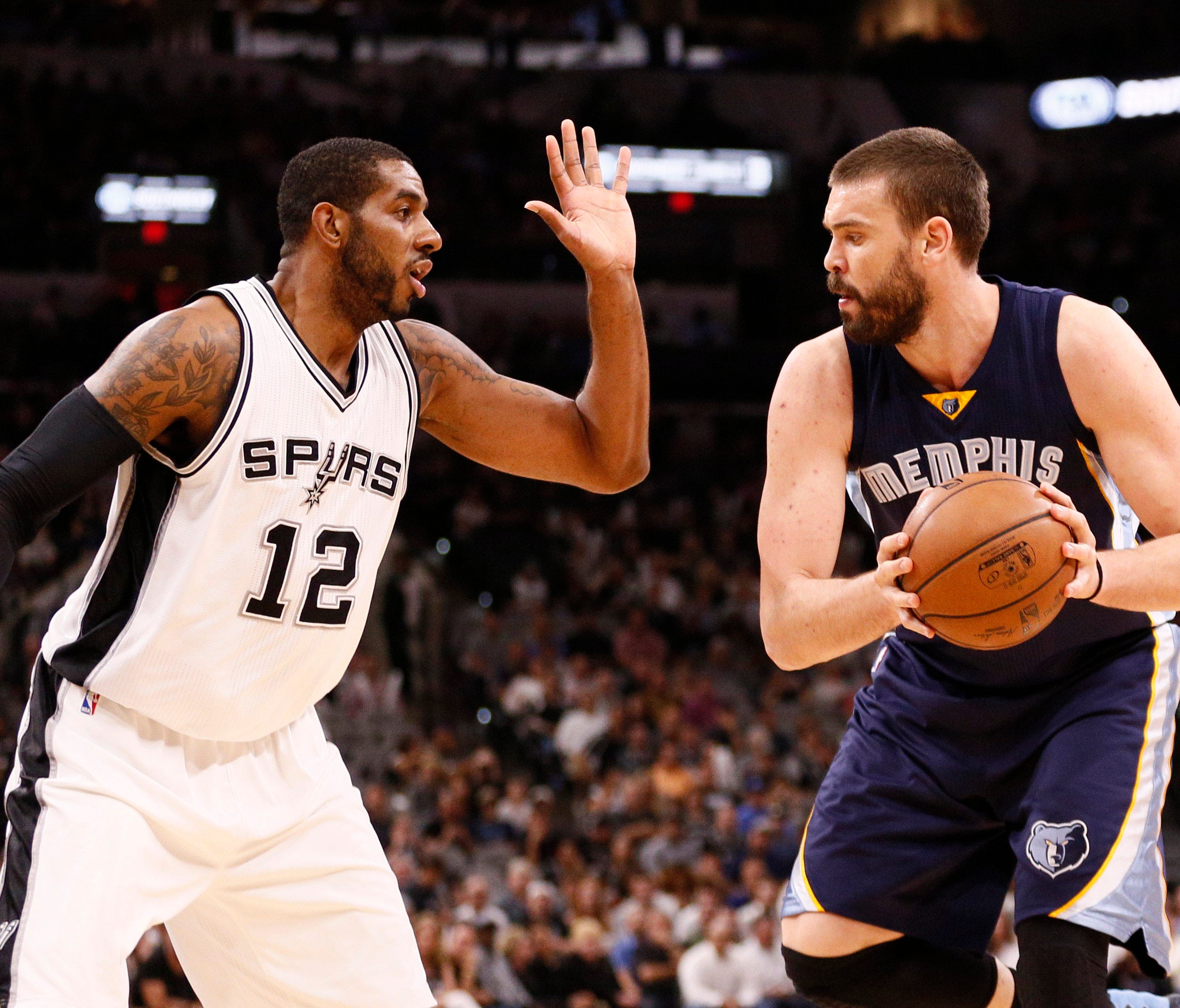 Memphis Grizzlies center Marc Gasol (right) is defended by San Antonio Spurs power forward LaMarcus Aldridge (12) during the first half in game five of the first round of the 2017 NBA Playoffs at AT&T Center.