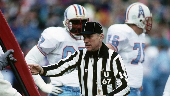 NFL photos/Associated Press NFL umpire John Keck takes a measurement during the AFC Divisional Playoff, a 26-24 Denver Broncos victory over the Houston Oilers, on Jan. 4, 1992, at Mile High Stadium in Denver. NFL umpire John Keck takes a measurement during the AFC Divisional Playoff, a 26-24 Denver Broncos victory over the Houston Oilers on January 4, 1992, at Mile High Stadium in Denver, Colorado. 1991 AFC Divisional Playoff Game - Houston Oilers vs Denver Broncos - January 4, 1992 (AP Photo/NFL Photos)